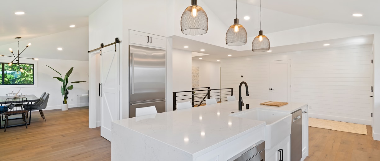 turned on pendant lamps above kitchen island